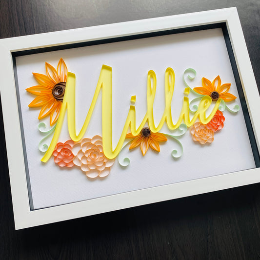 Yellow Quilled name Millie surrounded by sunflowers and roses