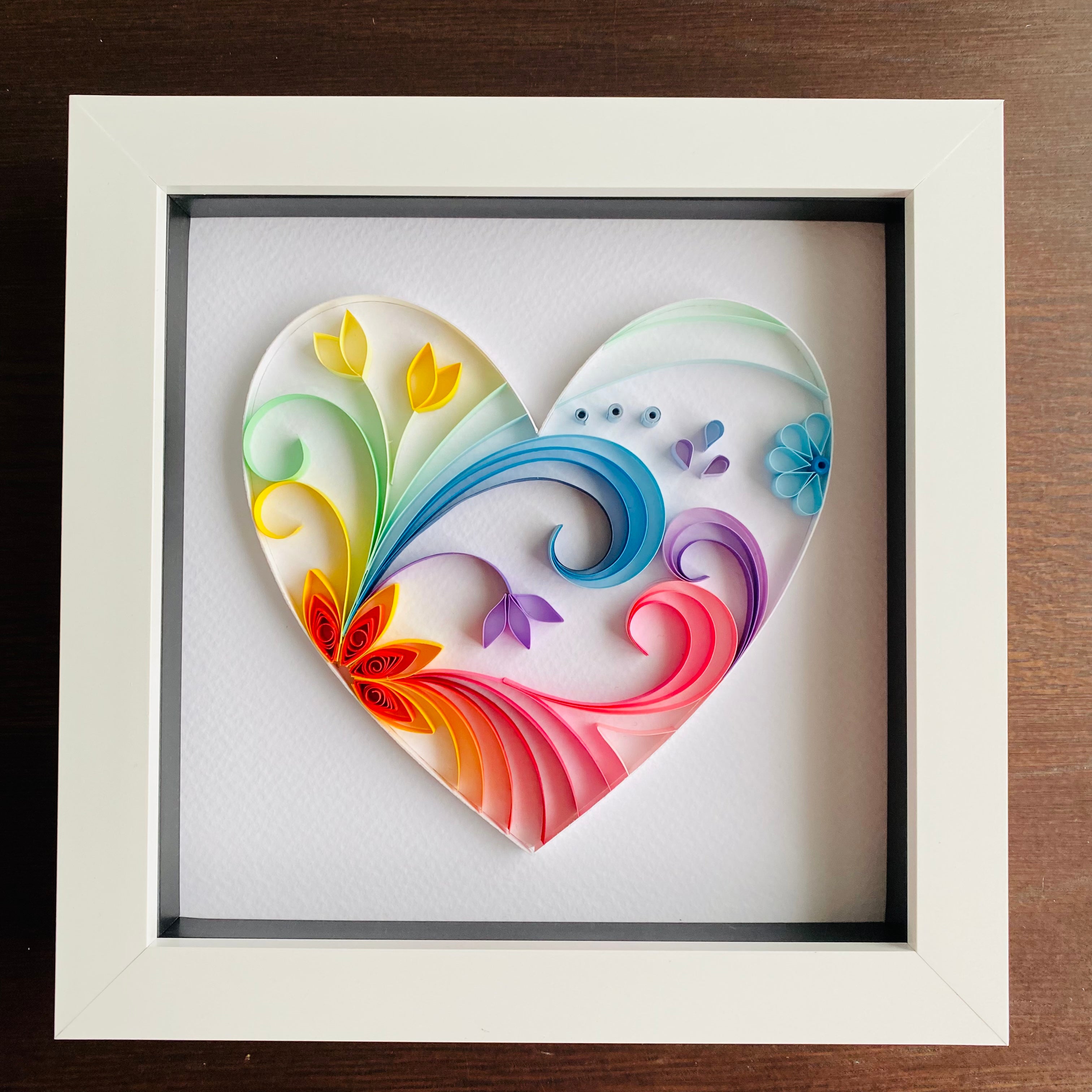 Paper quilled rainbow heart in white box frame