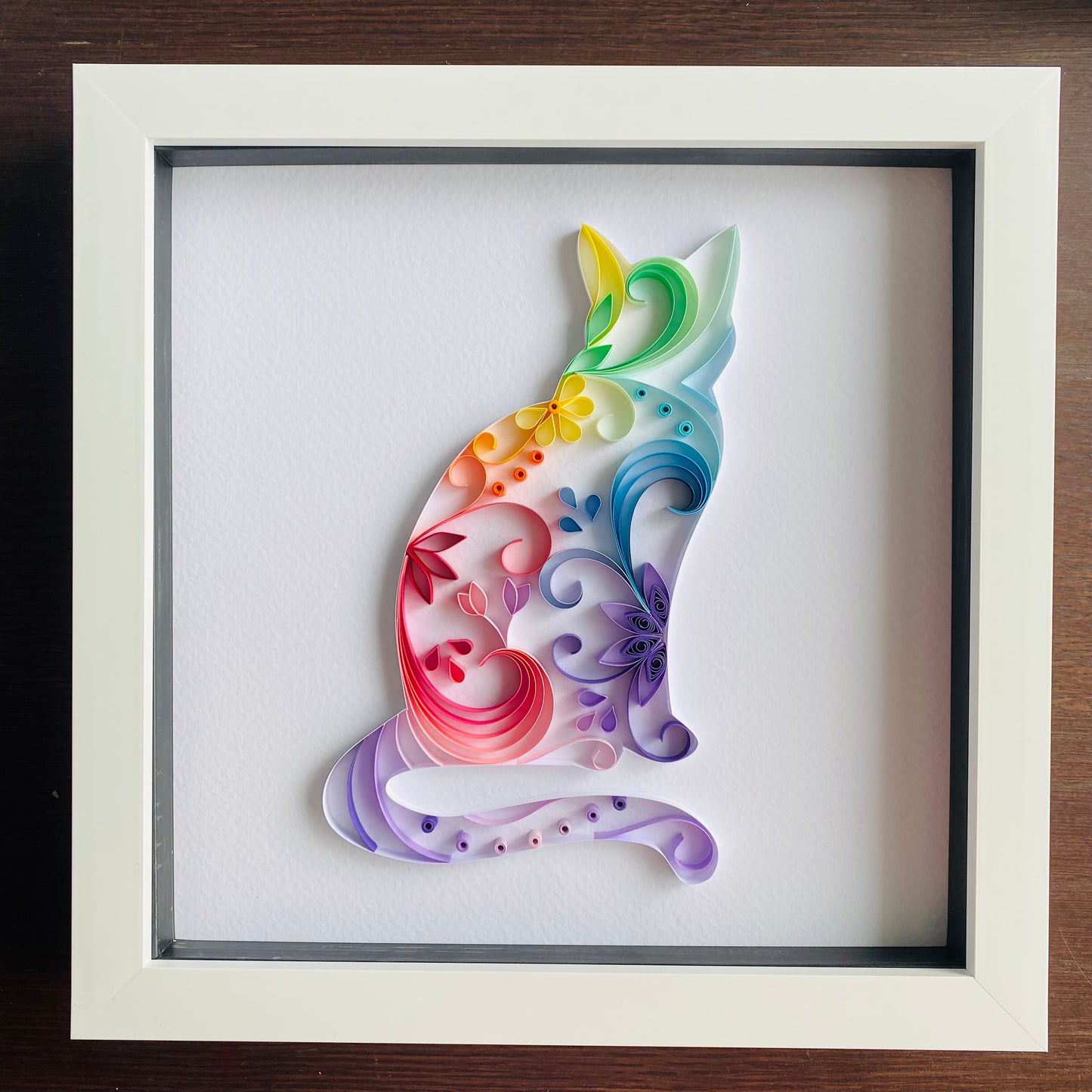 Rainbow cat quilling art created by twirling paper strips